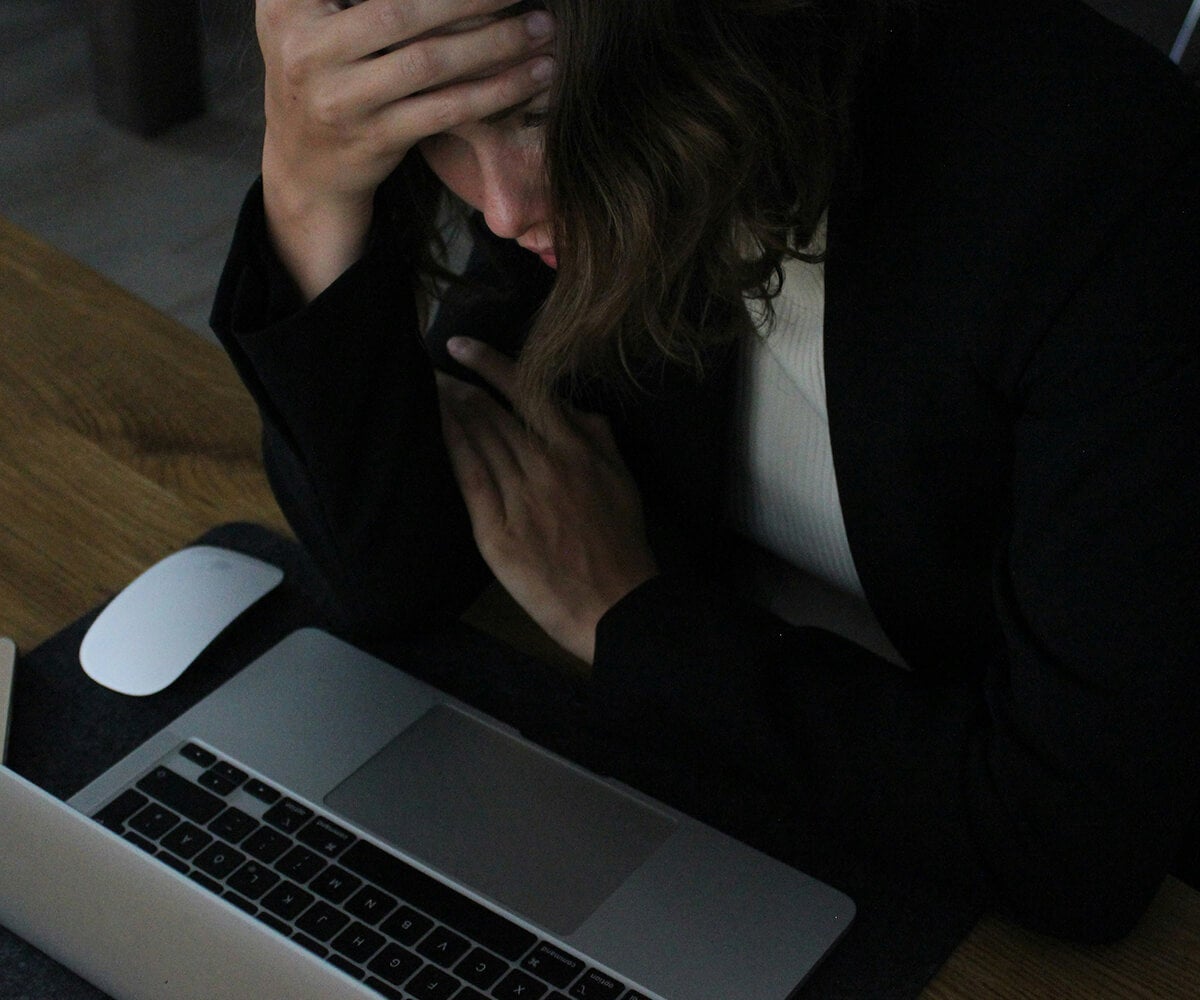 Woman Stressed At Laptop